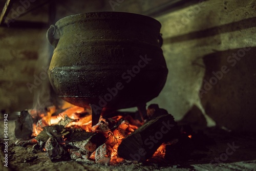 Fotografie, Obraz Closeup of rustic old pot on bonfire