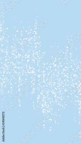 Magic falling snow christmas background. Subtle flying snow flakes and stars on light blue winter backdrop. Magic falling snow holiday scenery.   Vertical vector illustration.