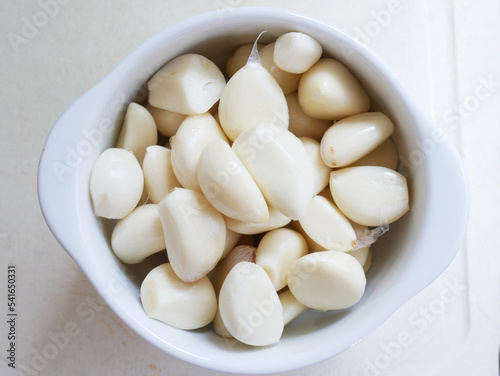 Garlics of white plate. Close-up