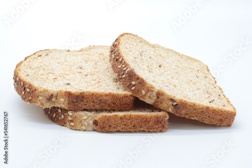 sliced ​​wholemeal bread, on white background. Concept of healthy food, balanced breakfasts, fiber foods.