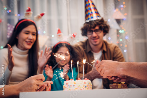 Fotografie Happy family celebrating birthday together at home