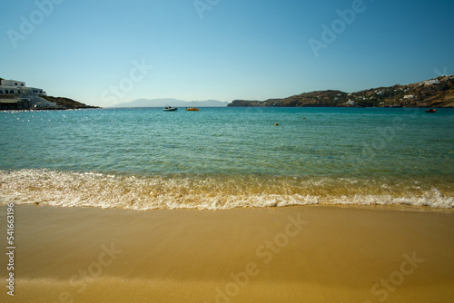 Amazing golden sand and turquoise waters at the popular beach of Mylopotas in Ios Greece © DIMITRIOS