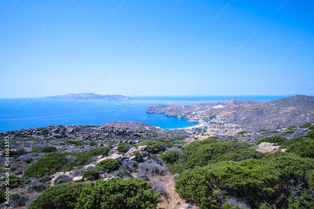 Breathtaking panoramic view of the famous Mylopotas beach in Ios Greece and the island of Sikinos in the background