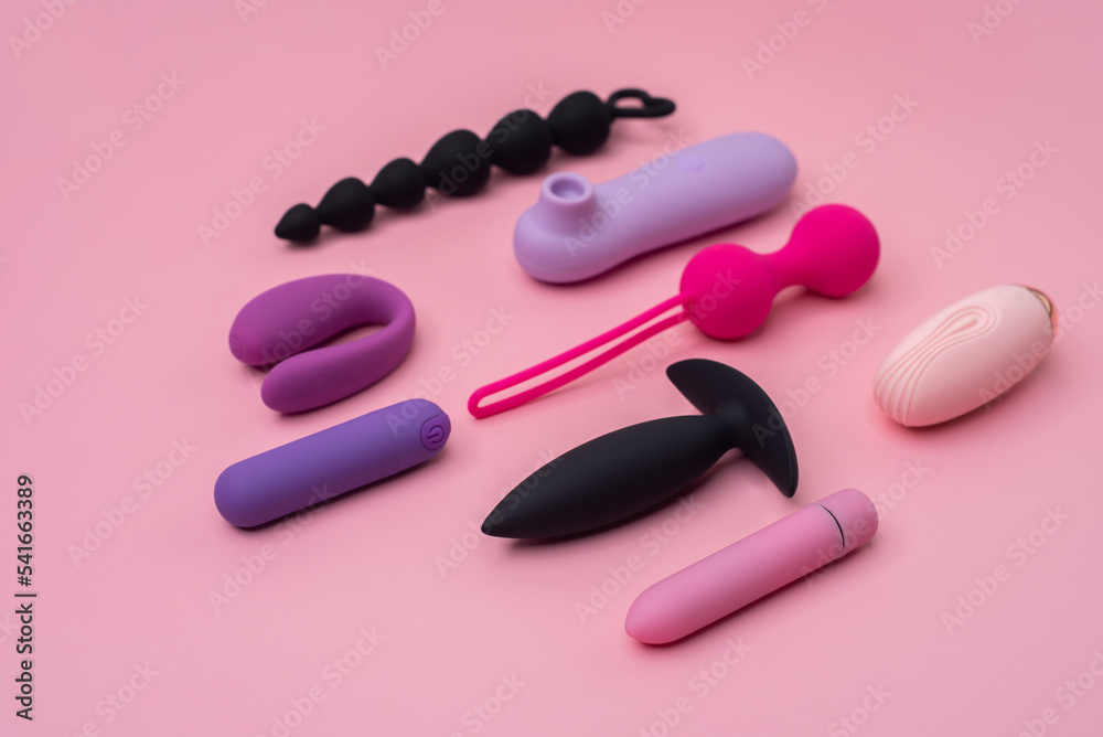Variety of sex toys on a pink background Variety of sex toys on a pink background