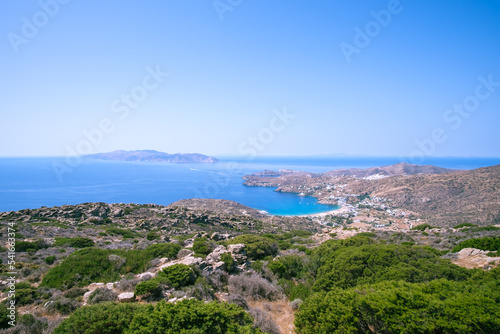 Fototapeta Naklejka Na Ścianę i Meble -  Breathtaking panoramic view of the famous Mylopotas beach in Ios Greece and the island of Sikinos in the background