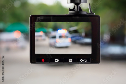 Car CCTV camera video recorder with ambulance car on the road