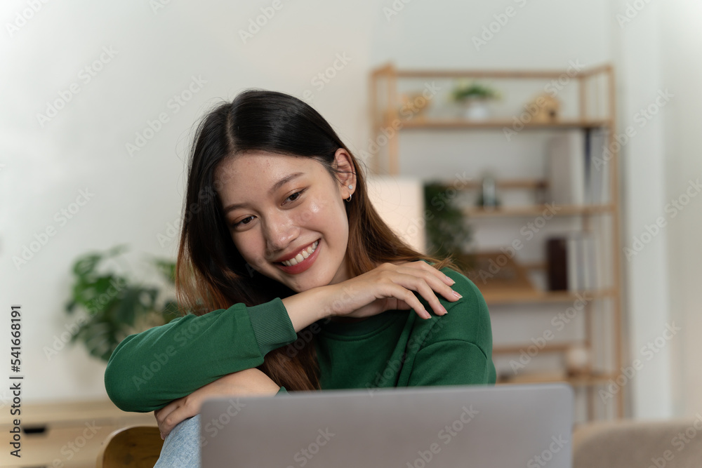 Asian girl with laptop computer on desk. Asian girl with laptop computer on desk.