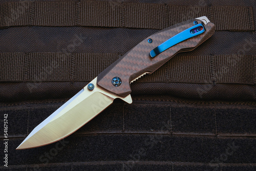 Folding pocket knife, closeup photo.