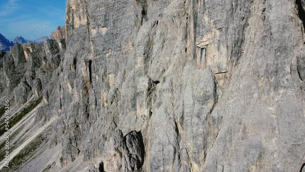 aerial orbit of sharp rocks along Dolomites mountain ridge on a sunny summer day aerial orbit of sharp rocks along Dolomites mountain ridge on a sunny summer day