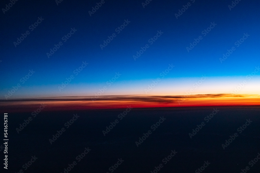 The sky from the plane window. Sunset sky from a height
