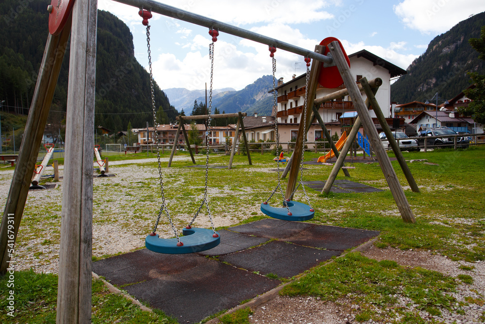 empty playground in a small alpine town empty playground in a small alpine town
