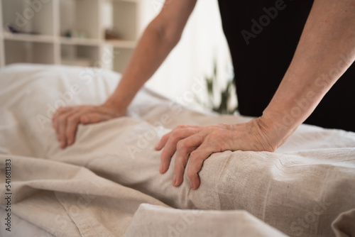 Hands of female healer doing massage