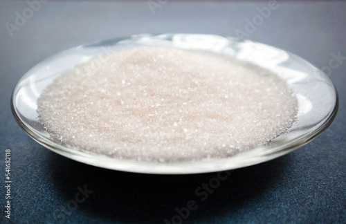 ammonium chloride sprinkled on a plate. Crystals are white. Ammonium chloride chemical concept. Photo for the product card on the site photo