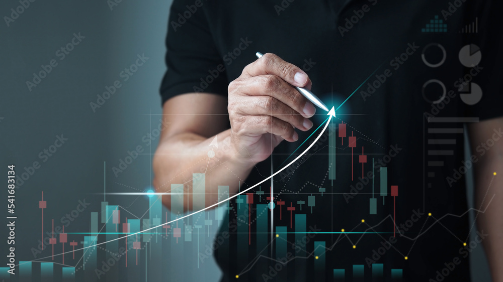 Businessman drawing a graph of stock market uptrend, stock trading and investment concept. - obrazy, fototapety, plakaty 