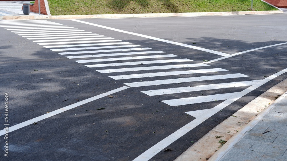 Fototapeta premium Pedestrian crossing, zebra cross, pedestrian cross on asphalt road