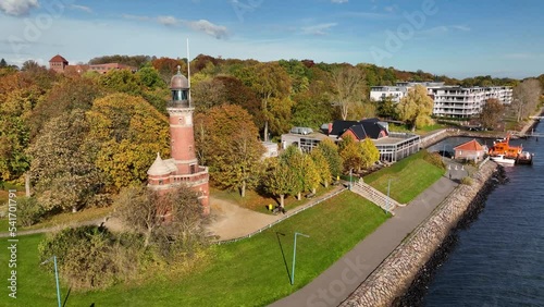 Aerial footage of the the Holtenau lighthouse and sea pilot transfer station at the Kieler Fjorde. Aerial view of Thiessen quay at the entrance to the Kiel Canal.
 photo