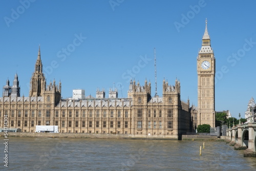 View of London  Houses of Parliament building with Big Ben. British history  Palace of Westminster  river bank.