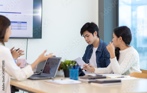 Young people meeting to discuss successful business projects in the office. Human relations and working with colleagues in the organization happily.