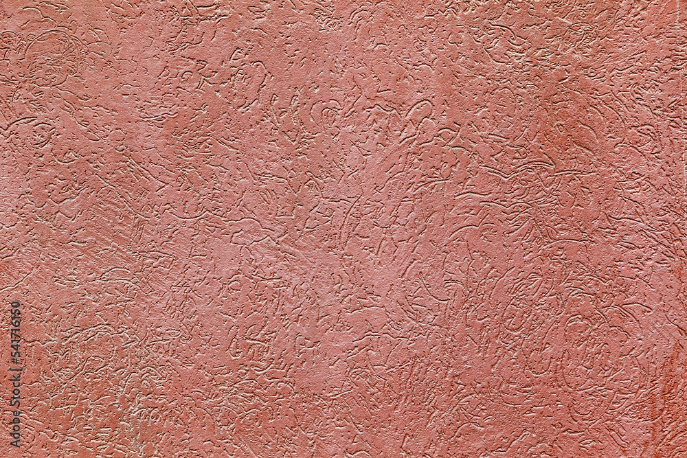 Fototapeta premium Fine detail light red textured plaster wall surface