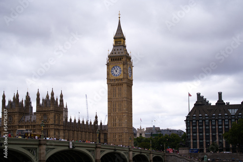 Cityscape with Elizabeth Tower with Big Ben bell at Westminster Palace at London on a cloudy summer day. Photo taken August 3rd, 2022, London, England.