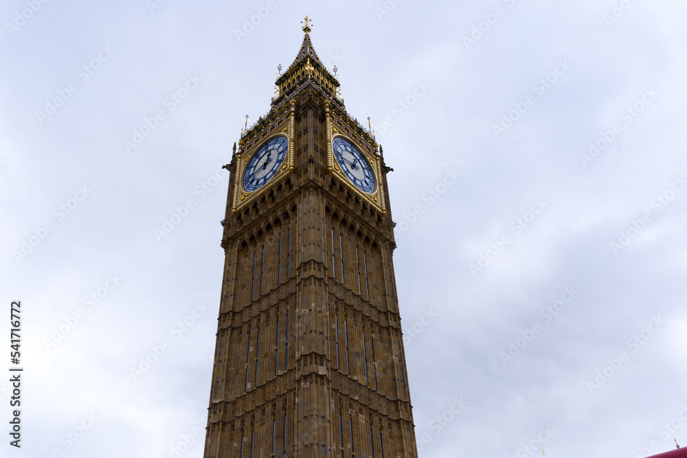 Cityscape with Elizabeth Tower with Big Ben bell at Westminster Palace at London on a cloudy summer day. Photo taken August 3rd, 2022, London, England. Cityscape with Elizabeth Tower with Big Ben bell at Westminster Palace at London on a cloudy summer day. Photo taken August 3rd, 2022, London, England.