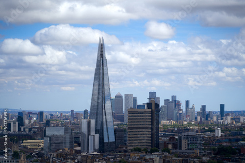 Aerial view of London with skyline and skyscraper The Shard on a cloudy summer day. Photo taken August 3rd, 2022, London, United Kingdom.