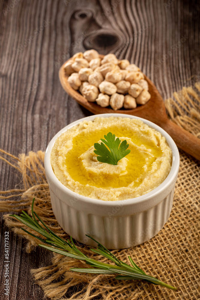 Chickpeas hummus with olive oil in the bowl. Chickpeas hummus with olive oil in the bowl.
