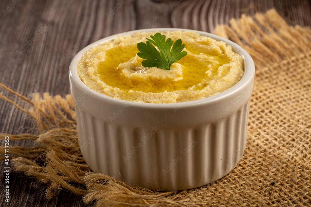 Chickpeas hummus with olive oil in the bowl. Chickpeas hummus with olive oil in the bowl.