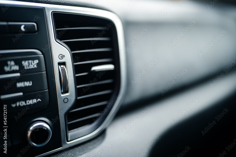 sign of air conditioning in the car on the panel with buttons. Warm or cold inside. comfortable driving.