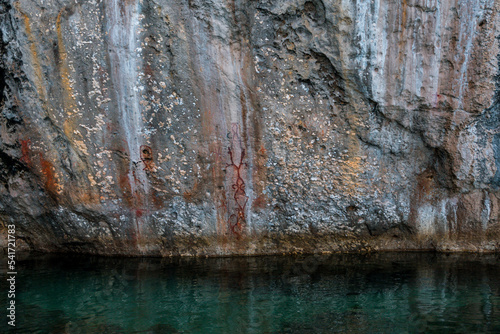 Mystery Red painting on a stone wall, located in Teluk Cendrawasih National Park, West Papua Province
