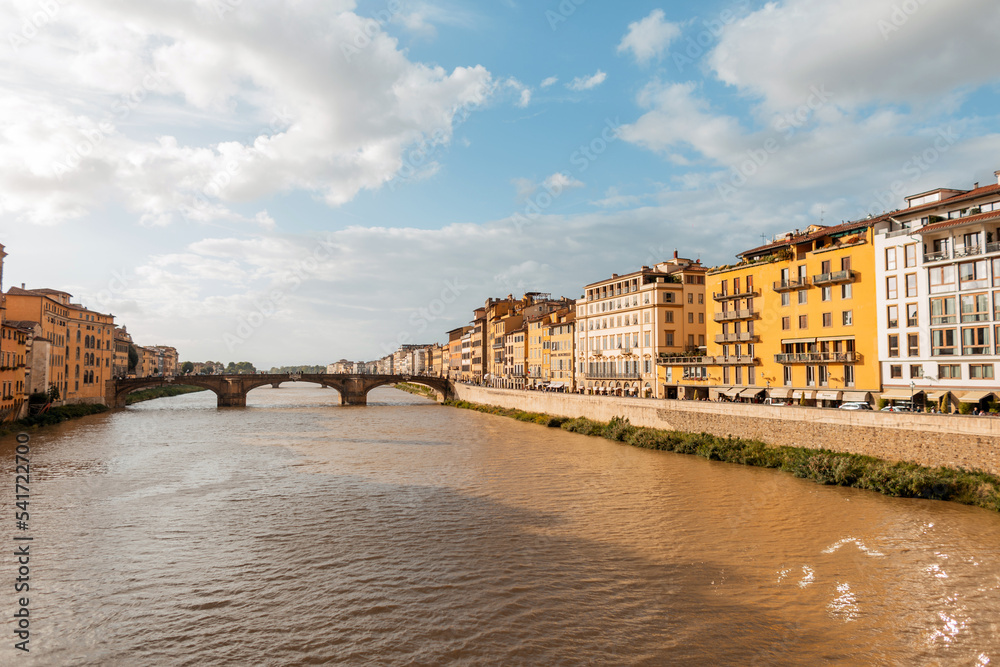 Amazingly beautiful vintage town with colorful buildings near the river with the bridge in Florence, Italy