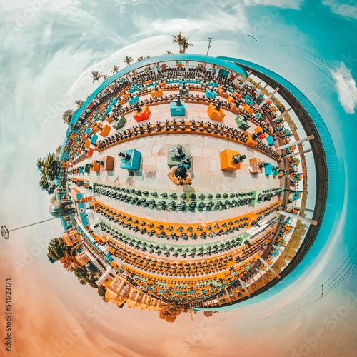 Aerial 360-degree shot of Kotilingeshwara Temple in India with palm trees and statues photo