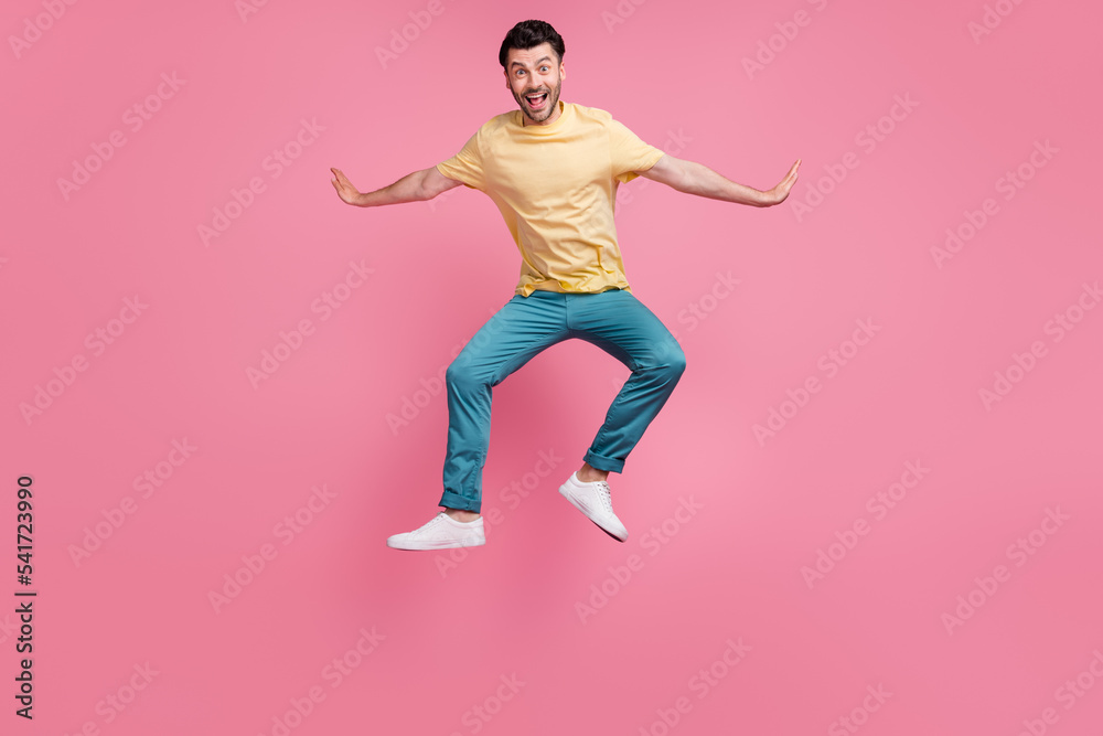Full length photo of joyful nice man celebrate achievement suacces win victory isolated on pink color background
