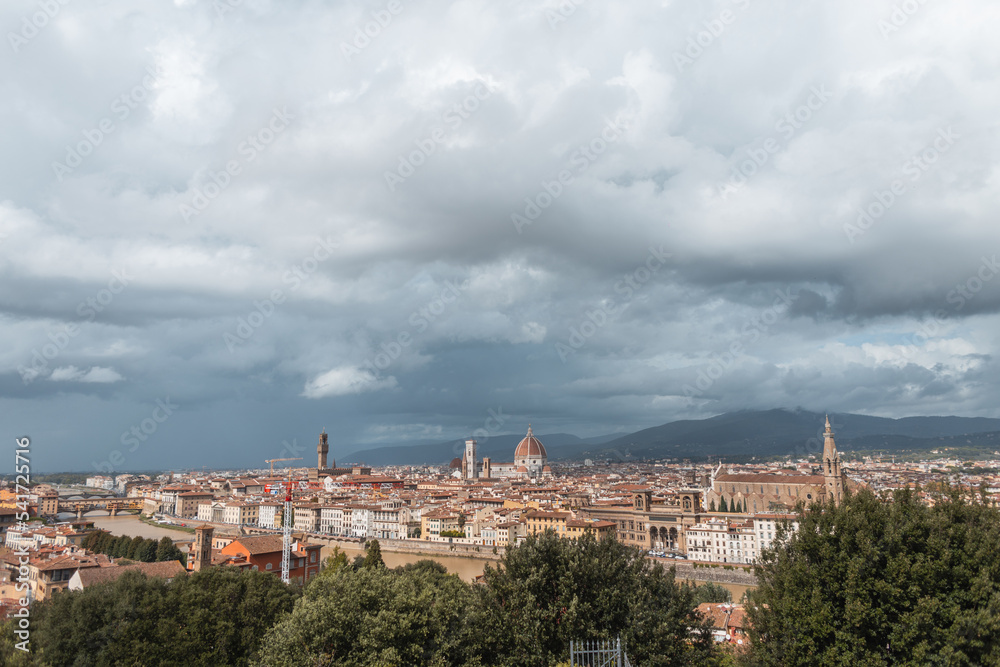 Amazing old town with vintage houses and cathedrals on a cloudy day with clouds in Florence, Italy