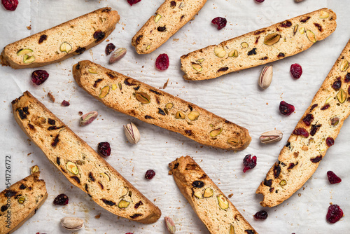 Slika na platnu Biscotti cookies food background with cranberry and pistachio nuts, top view