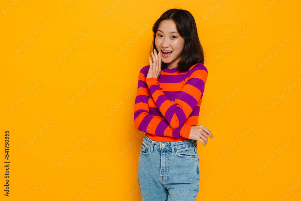 Asian brunette woman smiling and looking at camera Asian brunette woman smiling and looking at camera