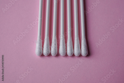 cotton swabs on the pink background  cosmetic and hygienic product