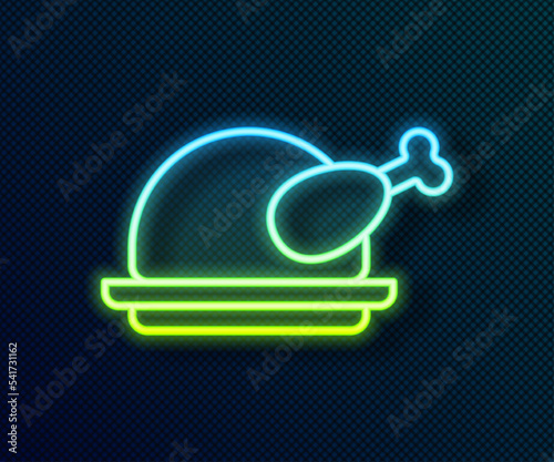 Glowing neon line Roasted turkey or chicken icon isolated on black background. Vector