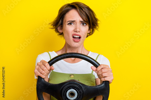 Photo portrait of pretty young girl confused grimace car accident mistake dressed stylish khaki garment isolated on yellow color background