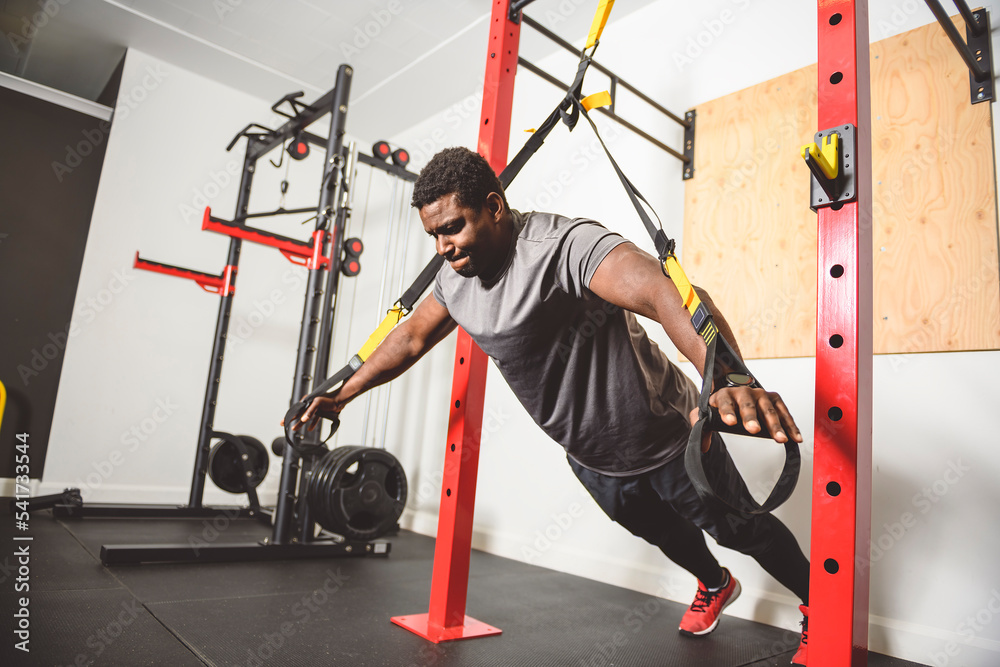 Fototapeta premium portrait of a male fitness workout in the modern gym
