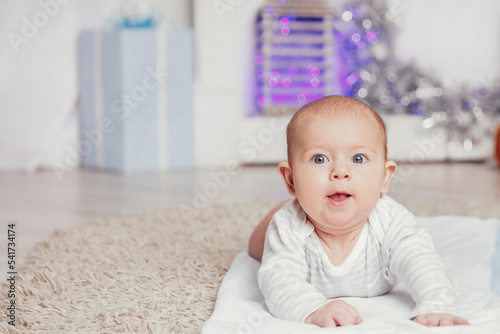 portrait of four - month-old happy child in the nursery
