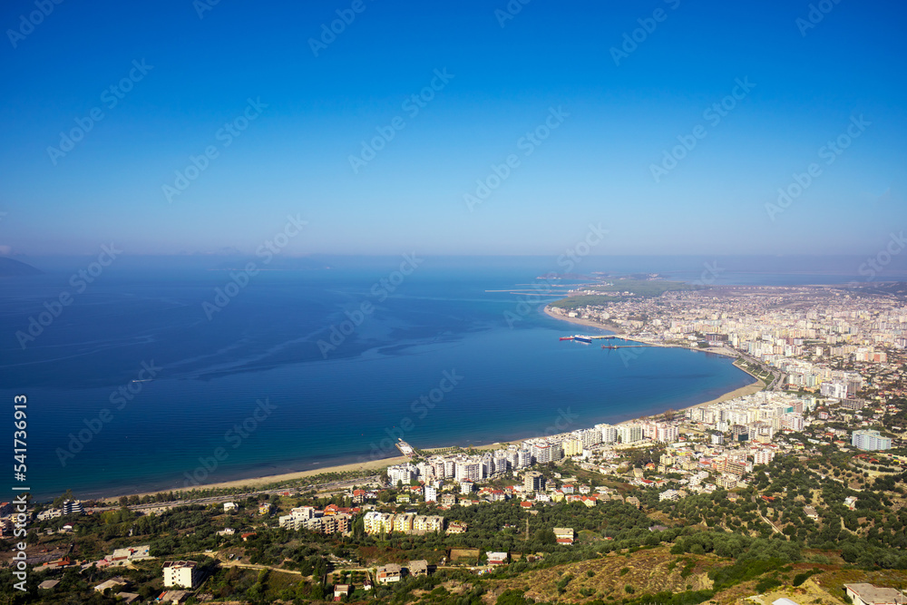 Attractive spring cityscape of Vlore city from Kanines fortress. Captivating sunset sescape of Adriatic sea. Spectacular outdoor scene of Albania, Europe. Traveling concept background.