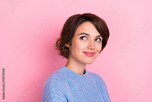 Photo of positive pretty girl look interested empty space fantasize isolated on pink color background © deagreez