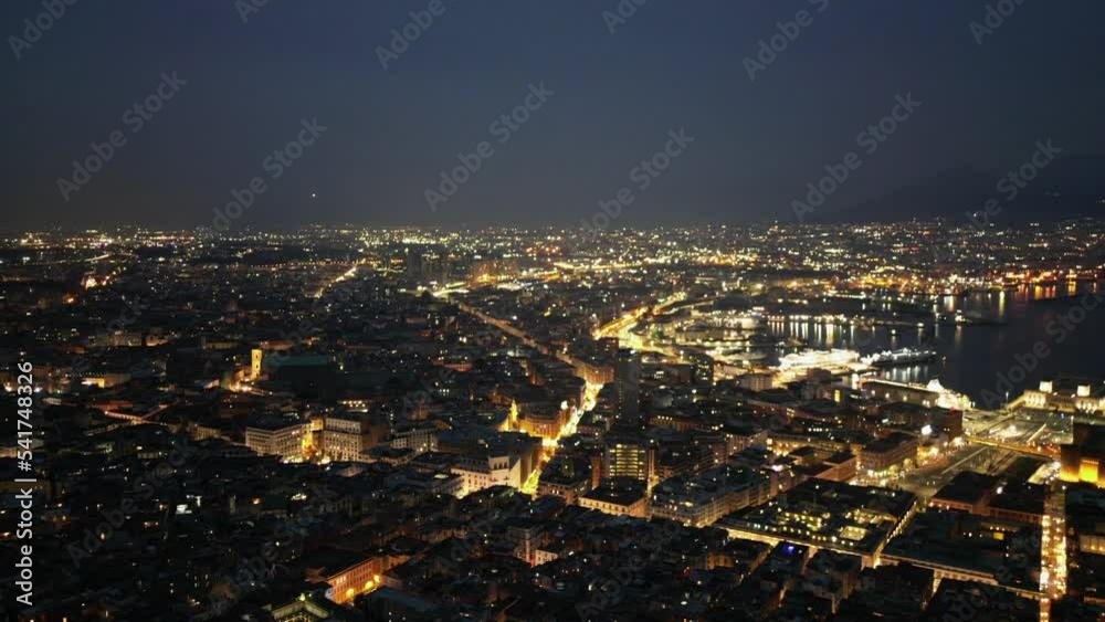Timelapse over Naples city from day to night with seaport and Vesuvius aerial view Timelapse over Naples city from day to night with seaport and Vesuvius aerial view