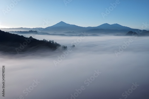 Mountains and valley blanketed in thick fog.  © ECrafts