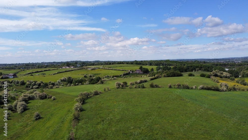 Aerial view of green fields and open countryside. Taken in Lancashire England. 