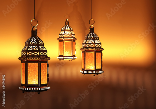 Glowing arabic lanterns emitting light in the night, 3d render photo