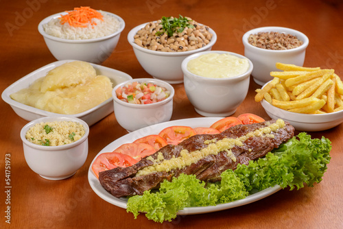Sun meat and side dishes. Carne de sol, salted steak, typical dish from the Brazilian northeast.