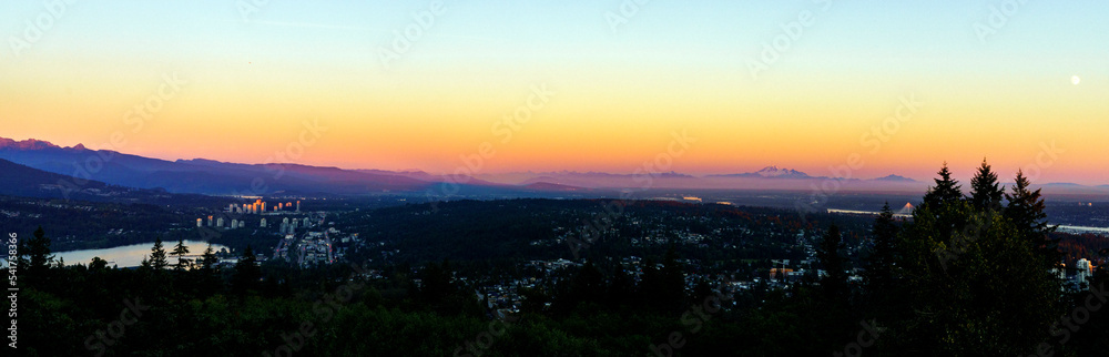 Fraser Valley sunset panorama with Mount Baker on horizon as viewed from a Burnaby Mountain residence.