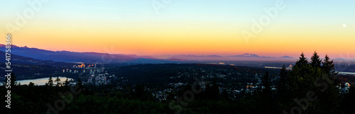 Fraser Valley sunset panorama with Mount Baker on horizon as viewed from a Burnaby Mountain residence.